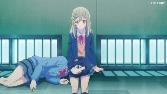 Adachi rests her head on Shimamura's lap